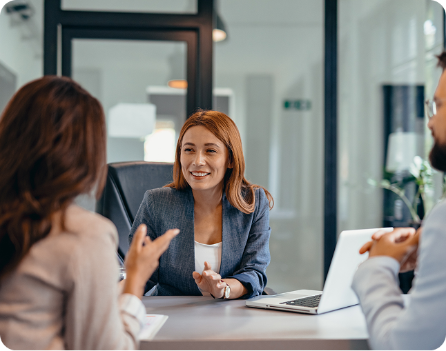 Three people having a business meeting.